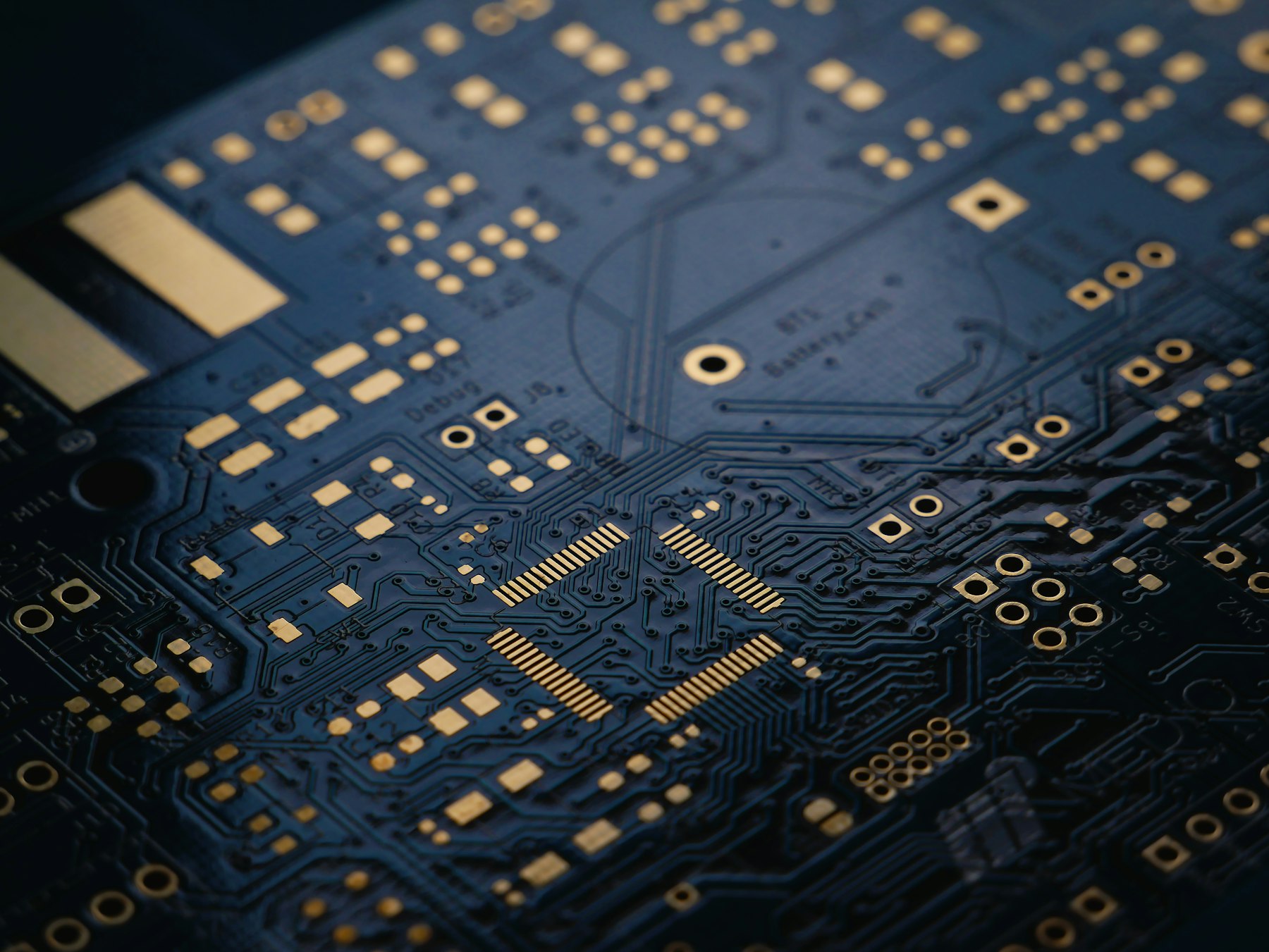 Macro photograph of a populated circuit board, illustrative of chip-level hardware