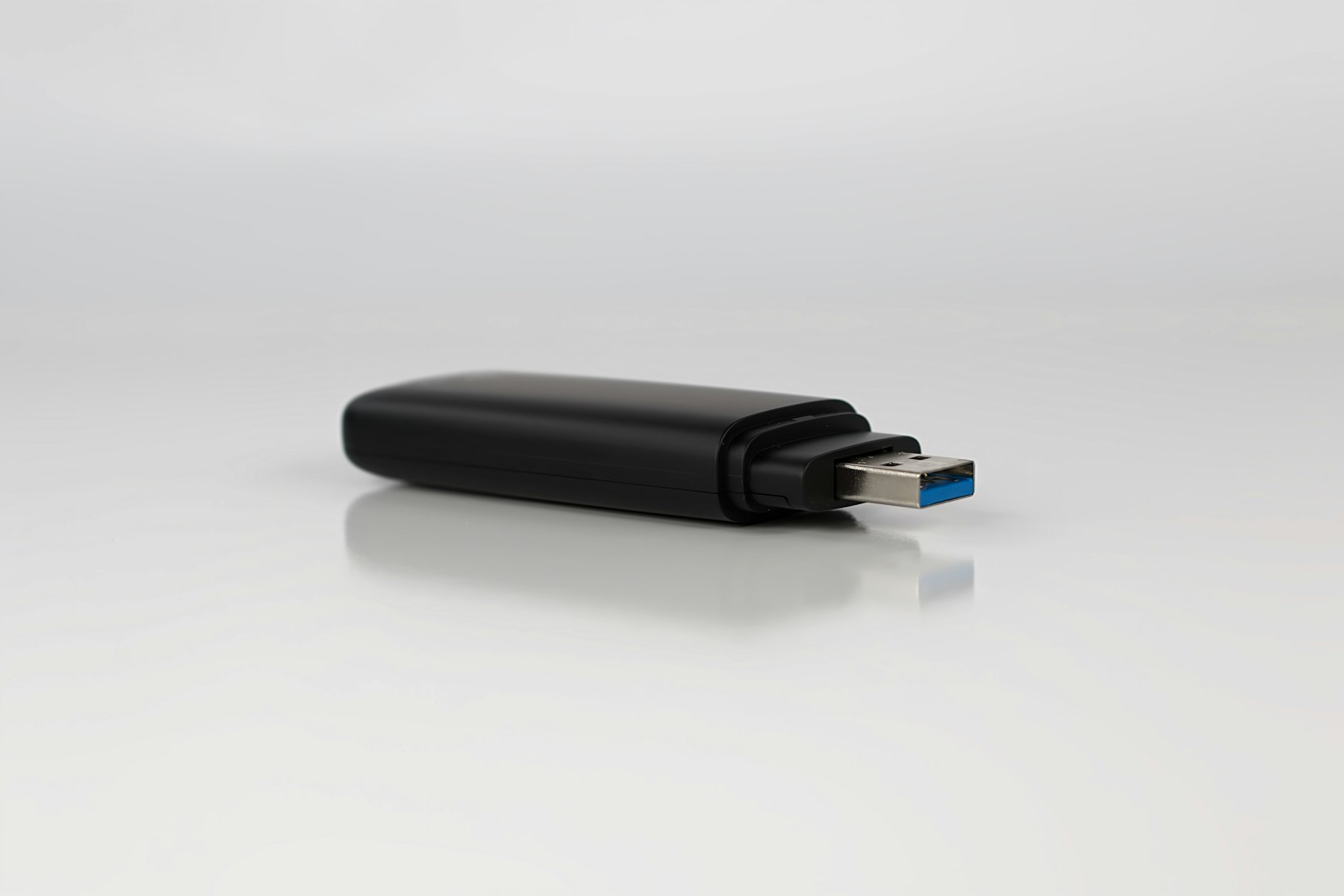 A plain, unmarked black USB security key — illustrative of the unbranded VeePKey form factor